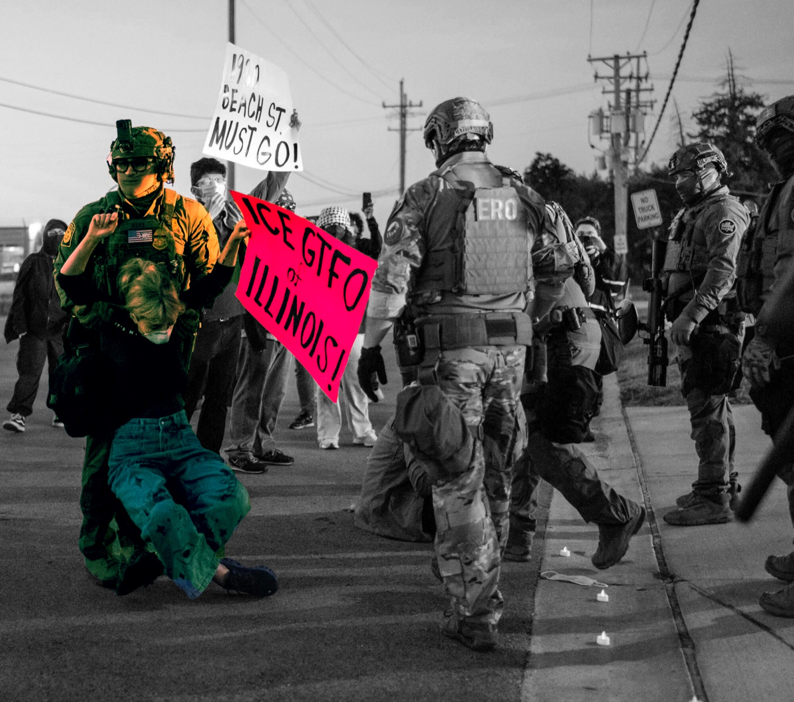 Camouflaged federal agents, one in a vest marked ERO, force a woman to the pavement at dusk while protesters film; a pink sign reading 'ICE GTFO of ILLINOIS' and a white 'BEACH ST MUST GO!' sign rise behind them, and small candles line the curb.